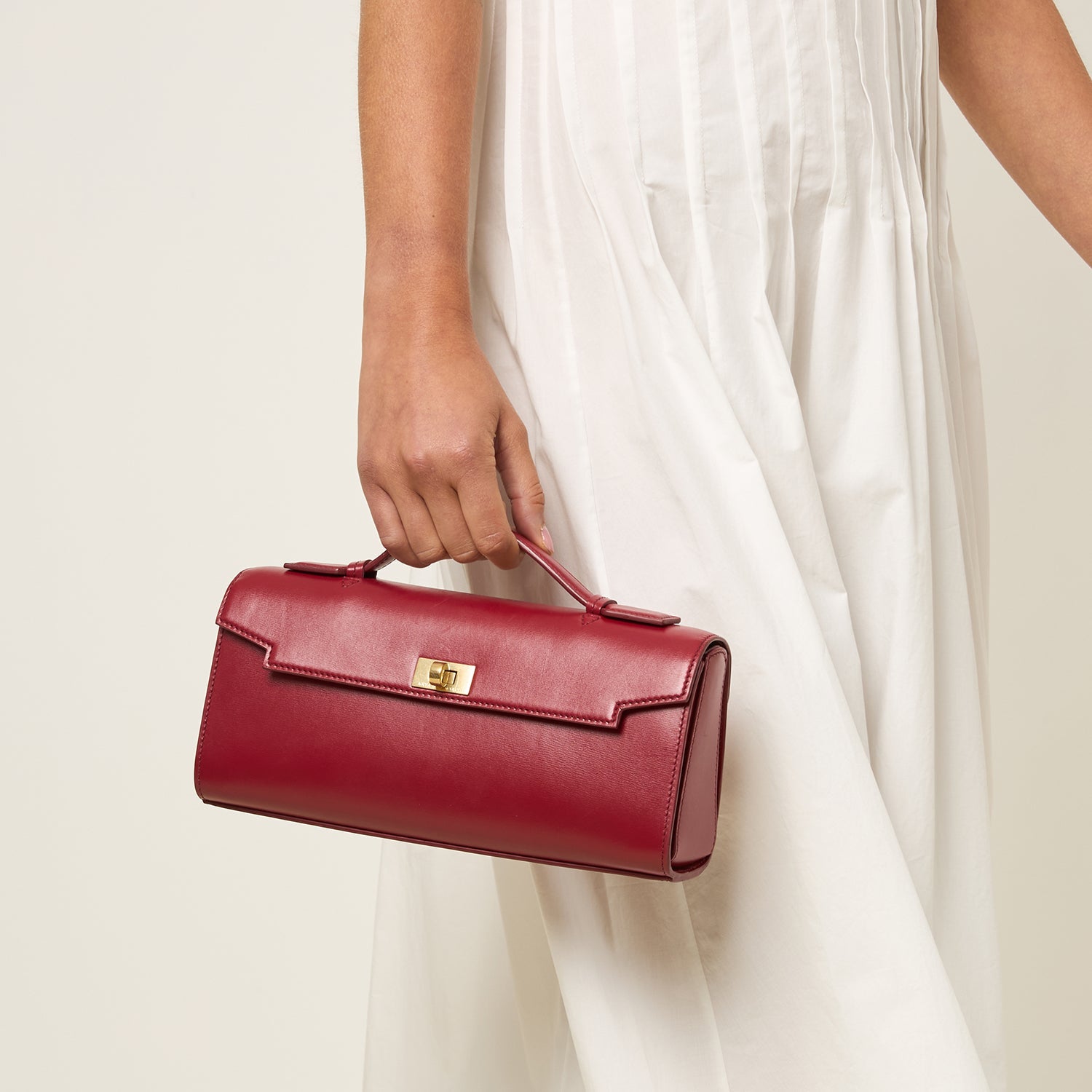 Red calf leather clutch by Anya Hindmarch