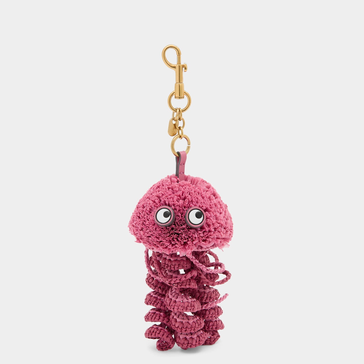Pink jellyfish charm made of raffia by Anya Hindmarch
