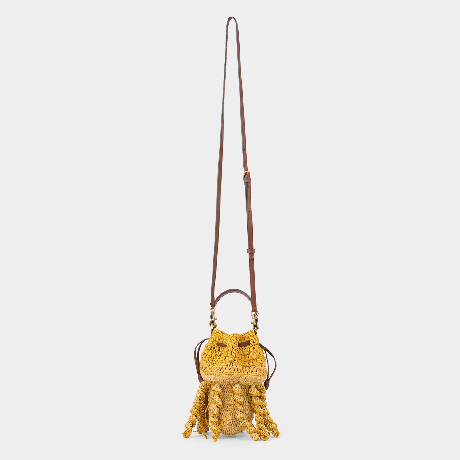 Hanwoven crossbody Jellyfish bag in  Raffia with Smooth Eco Leather made by anya hindmarch