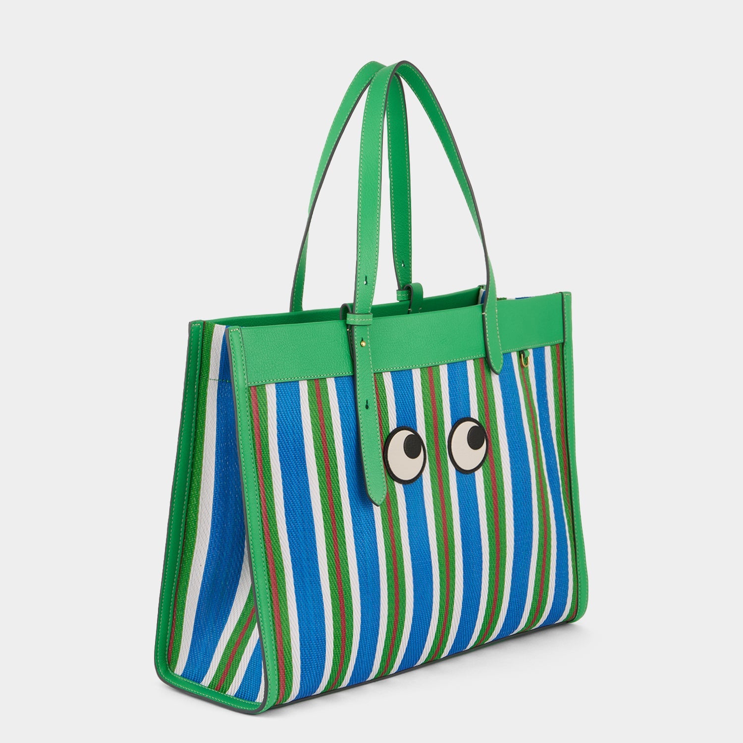 Striped tote bag with eyes made using recycled plastic by Anya Hindmarch