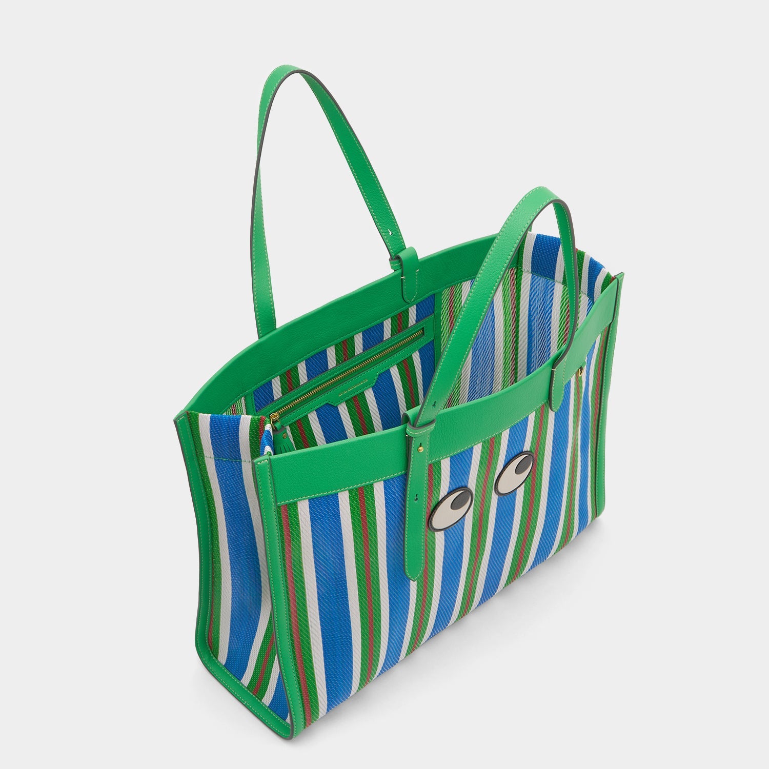 Striped tote bag with eyes made using recycled plastic by Anya Hindmarch