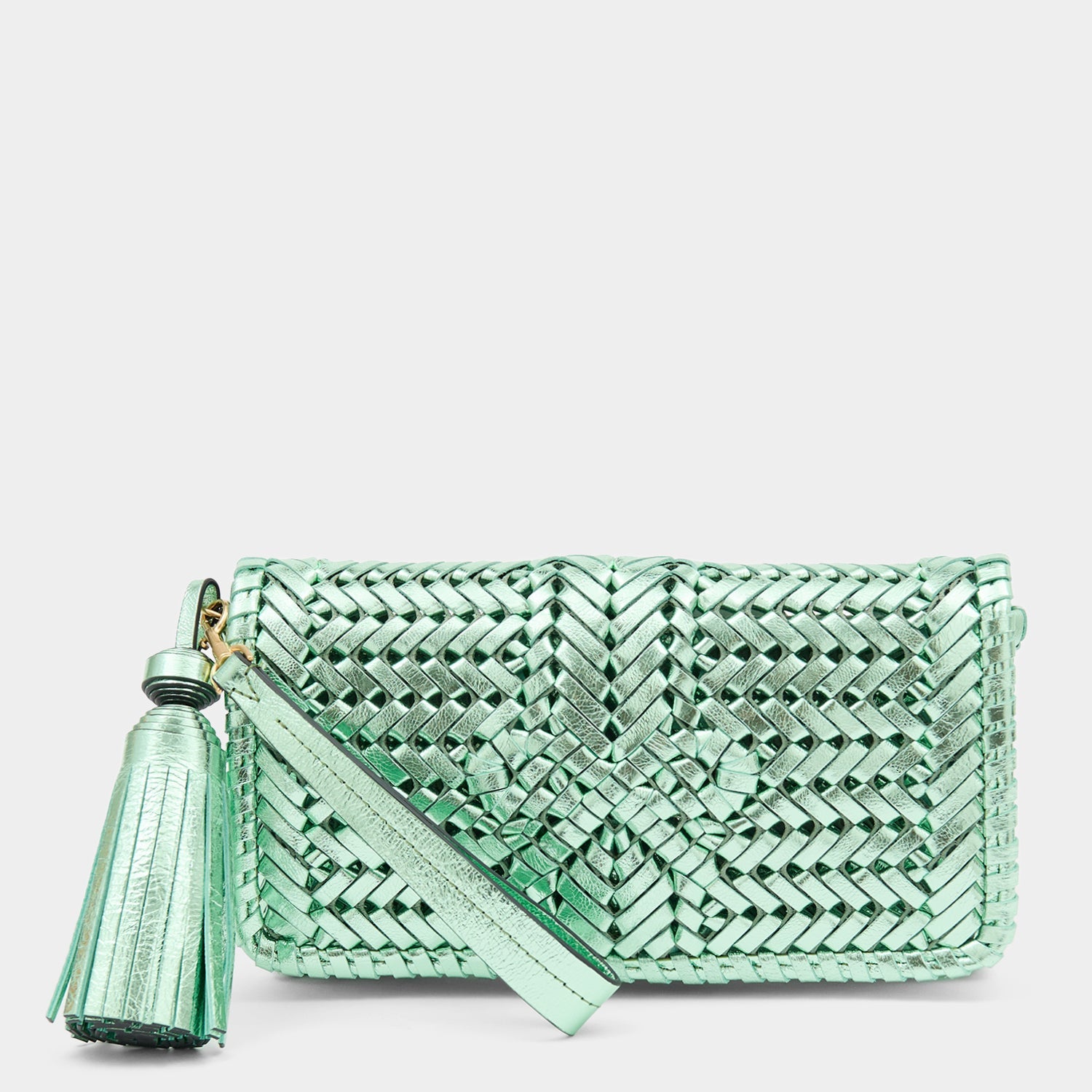 Metallic green handwoven leather clutch by Anya Hindmarch