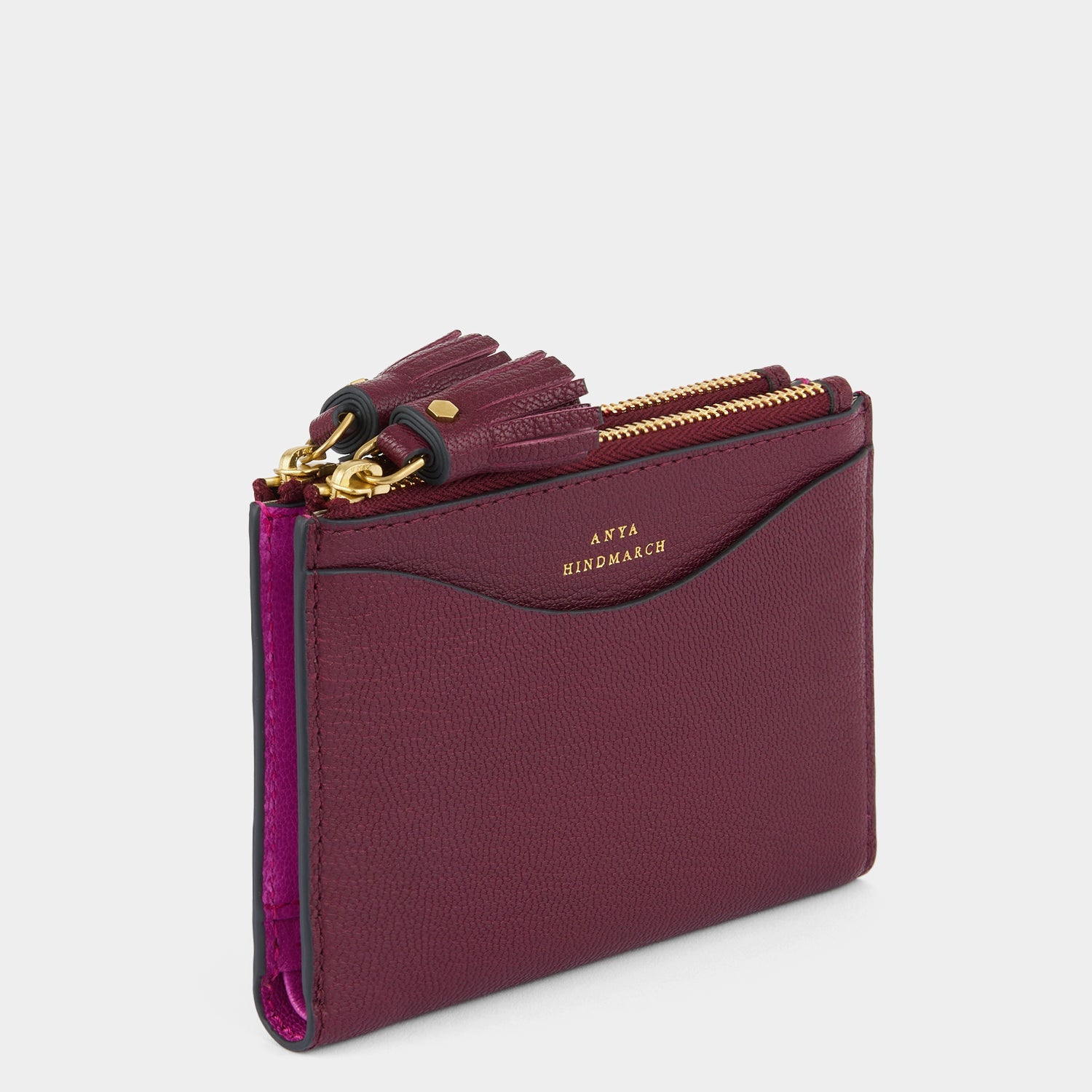 Purple double zip wallet with peeping eyes by Anya Hindmarch