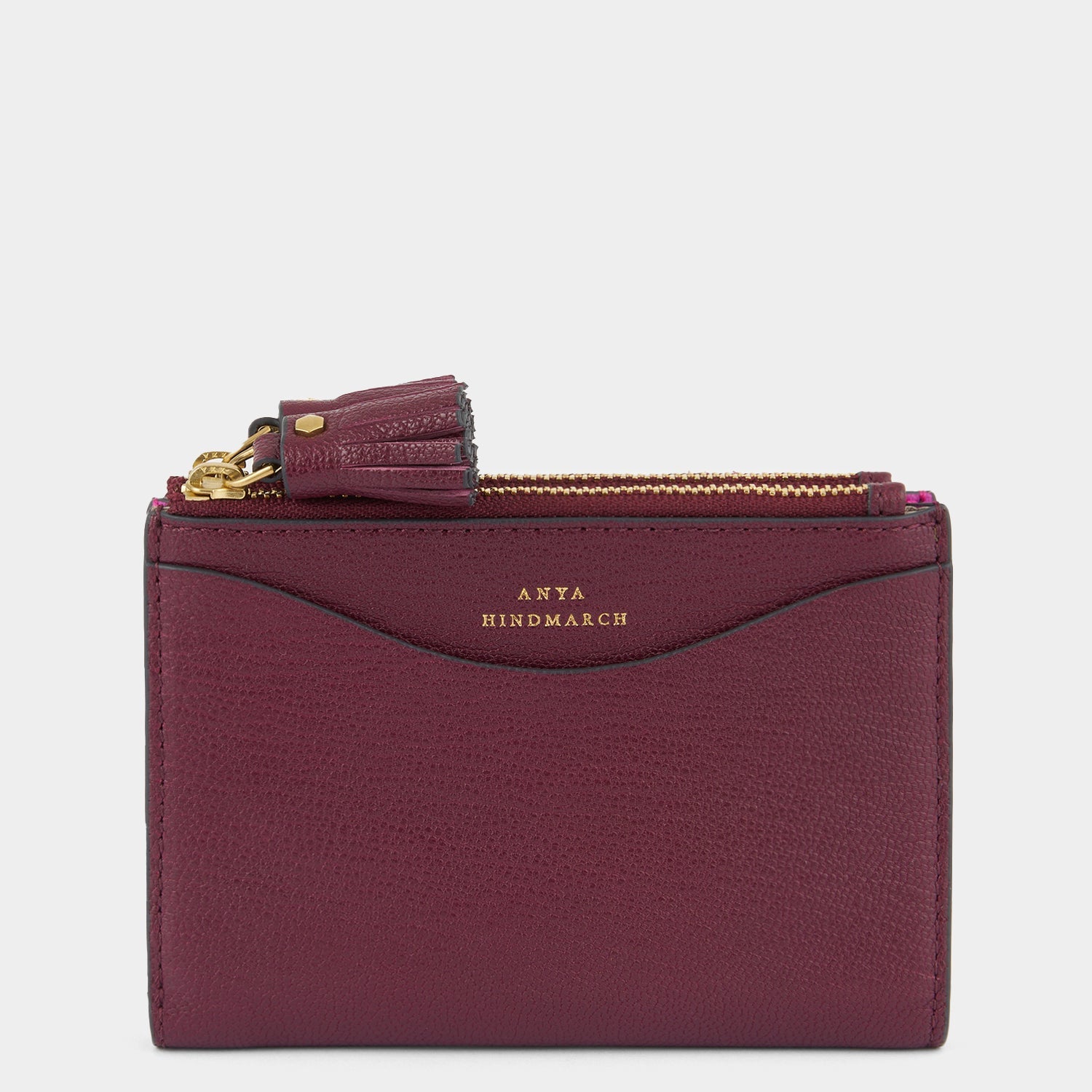 Purple double zip wallet with peeping eyes by Anya Hindmarch