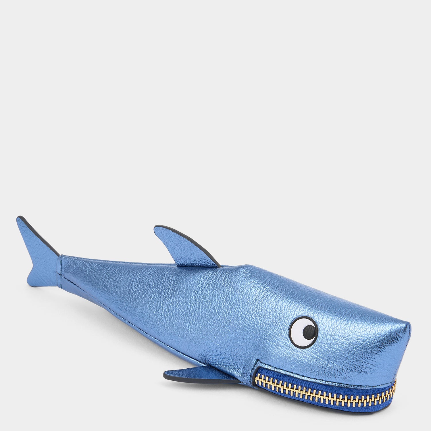 Shark Pencil Case crafted from metallic capra leather with appliquéd eyes and a tassel zippered mouth by Anya Hindmarch