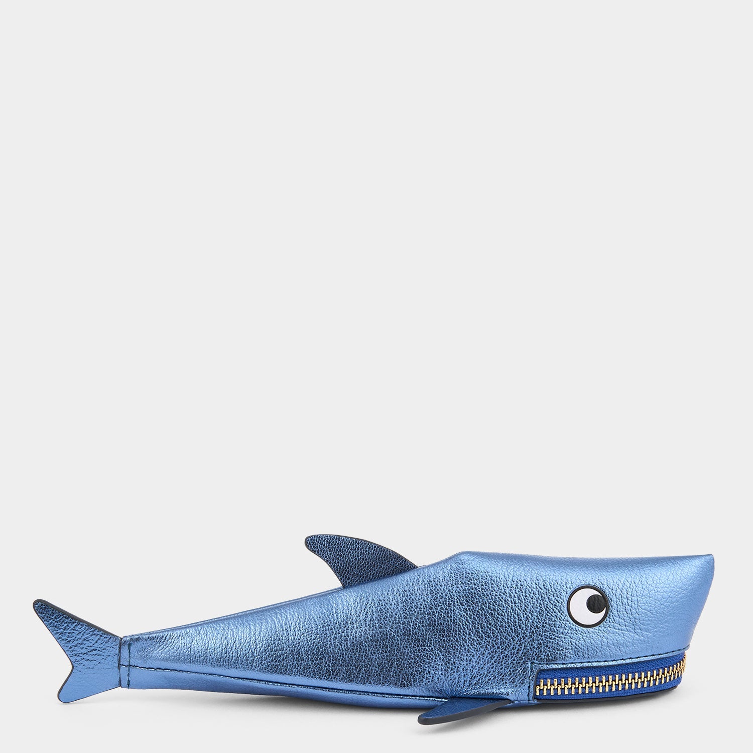 Shark Pencil Case crafted from metallic capra leather with appliquéd eyes and a tassel zippered mouth by Anya Hindmarch