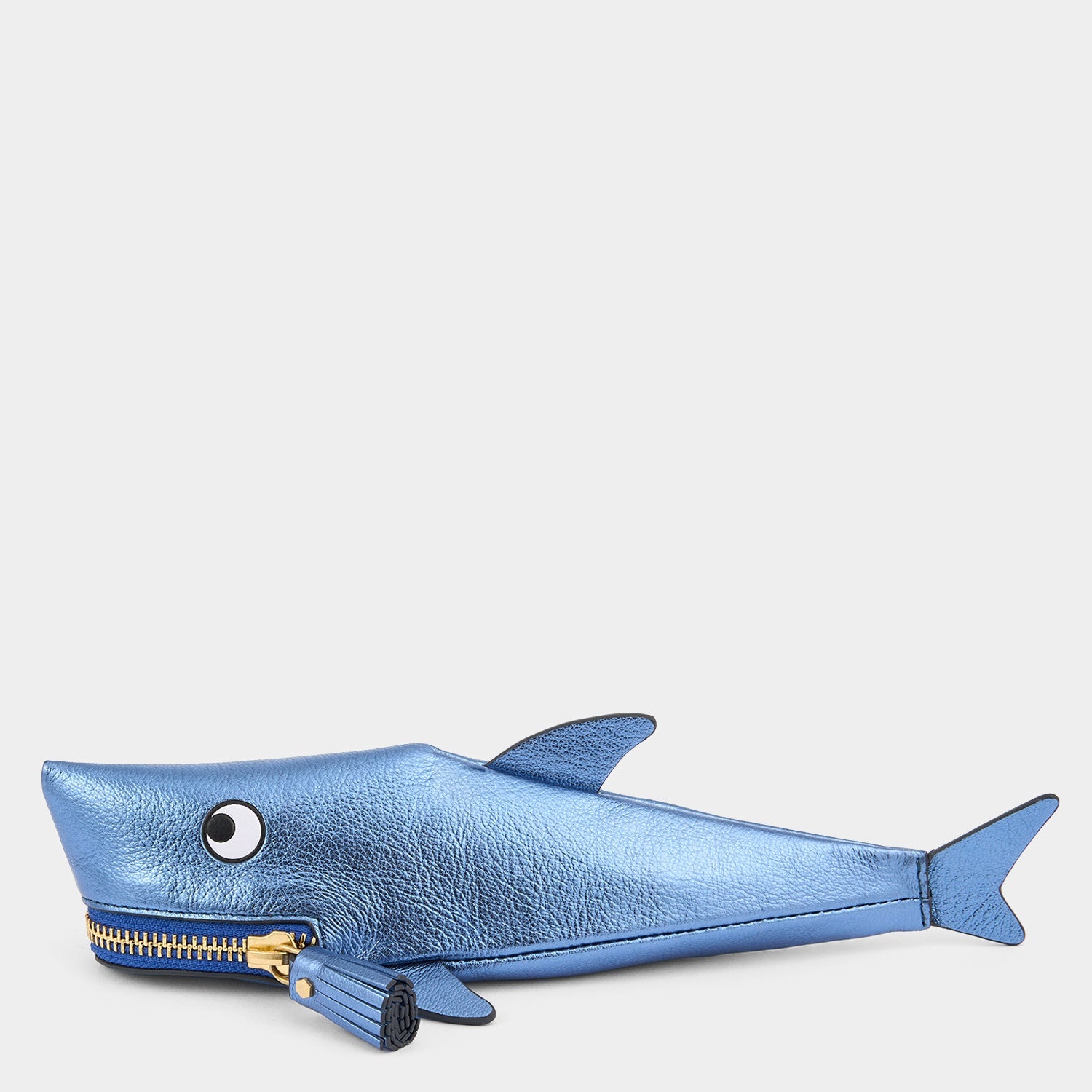 Shark Pencil Case crafted from metallic capra leather with appliquéd eyes and a tassel zippered mouth by Anya Hindmarch